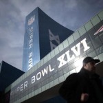 A man walks in downtown Indianapolis ahead of the Super Bowl XLVI NFL football game