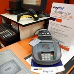 A sign showing customers’ ability to now pay with their PayPal account sits at a cashier station at a Home Depot store in Daly City